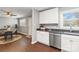 Open-concept kitchen with stainless steel dishwasher and sink, adjacent to a dining area at 1637 Sumner Dr, Rock Hill, SC 29732