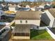 Aerial view showing a house with a screened porch and small backyard at 221 Brenett Francis Ct, Charlotte, NC 28214