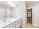 Double vanity bathroom with a large mirror and walk-in closet at 221 Brenett Francis Ct, Charlotte, NC 28214