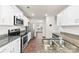 Modern kitchen featuring granite countertops and stainless steel appliances at 221 Brenett Francis Ct, Charlotte, NC 28214