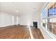 Living room with hardwood floors, fireplace and large window at 221 Brenett Francis Ct, Charlotte, NC 28214