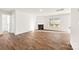 Living room with hardwood floors, fireplace, and access to bathroom at 221 Brenett Francis Ct, Charlotte, NC 28214