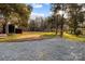 Spacious backyard with gravel area and trees at 2930 W Innes St, Salisbury, NC 28144