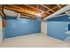 Unfinished basement with painted blue walls at 2930 W Innes St, Salisbury, NC 28144