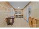 Basement kitchenette with wood paneled walls and tiled floor at 2930 W Innes St, Salisbury, NC 28144