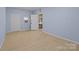 Spacious basement room with light blue walls and tiled floor at 2930 W Innes St, Salisbury, NC 28144