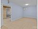 Unfinished basement room with light blue walls and tiled floor at 2930 W Innes St, Salisbury, NC 28144