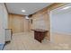 Finished basement room with wood paneled walls and tiled floor at 2930 W Innes St, Salisbury, NC 28144