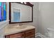 Bathroom with a sink, toilet, and large mirror at 2930 W Innes St, Salisbury, NC 28144