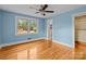 Bedroom with hardwood floors, light blue walls, and a ceiling fan at 2930 W Innes St, Salisbury, NC 28144