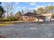 Brick home with carport, large yard, and gravel driveway at 2930 W Innes St, Salisbury, NC 28144