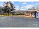 Covered carport with concrete slab and gravel at 2930 W Innes St, Salisbury, NC 28144