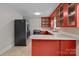 Galley kitchen with red cabinets and stainless steel appliances at 2930 W Innes St, Salisbury, NC 28144