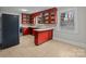 Kitchen with red cabinets and tile floors at 2930 W Innes St, Salisbury, NC 28144