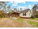 House exterior showcasing a large front yard and a spacious covered porch at 4450 Dobys Bridge Rd, Fort Mill, SC 29707