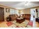 Spacious living room featuring a large sectional sofa, coffee table, and area rug at 4450 Dobys Bridge Rd, Fort Mill, SC 29707