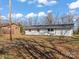 Back exterior of home with large backyard and blue sky at 529 Catalina Dr, Albemarle, NC 28001