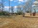 Backyard features large grass lot with partially fenced in yard at 529 Catalina Dr, Albemarle, NC 28001