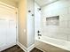 Bathroom shower and bathtub with white subway tile and a hexagon inset shelf at 529 Catalina Dr, Albemarle, NC 28001