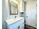 Bathroom with white vanity, grey walls, undermount sink, and chrome faucet at 529 Catalina Dr, Albemarle, NC 28001