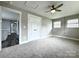 Bedroom features a ceiling fan, plush carpet, and neutral paint at 529 Catalina Dr, Albemarle, NC 28001