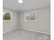 Bedroom featuring plush carpet, neutral paint, and natural light from windows at 529 Catalina Dr, Albemarle, NC 28001