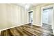 Bright dining room boasts modern light fixture and wood-look floors at 529 Catalina Dr, Albemarle, NC 28001