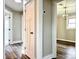 Hallway with updated doors and modern floors leads into the dining room at 529 Catalina Dr, Albemarle, NC 28001