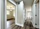 Hallway features updated doors and modern floors leading into the dining room at 529 Catalina Dr, Albemarle, NC 28001