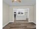 Living Room showing view into the kitchen and new laminate floors at 529 Catalina Dr, Albemarle, NC 28001