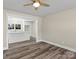 Living Room showing view into the kitchen and new laminate floors at 529 Catalina Dr, Albemarle, NC 28001