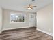 A living room featuring new laminate flooring and a new door at 529 Catalina Dr, Albemarle, NC 28001