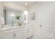 Double vanity bathroom with a large mirror and shower at 7109 N Mills Rd, Charlotte, NC 28216