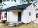 White house with blue accents and a covered porch at 123 Oak St, Chester, SC 29706