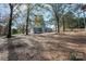 House with a large backyard surrounded by trees at 129 Doster Rd, Lancaster, SC 29720