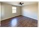 Bright bedroom featuring a ceiling fan, modern floors, and a window for natural light at 161 Westscott Dr, Statesville, NC 28625