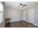 Bright bedroom with a ceiling fan, hardwood floors, and a classic bedside table at 161 Westscott Dr, Statesville, NC 28625