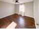 Bedroom with wood flooring, a ceiling fan, and a window with curtains for privacy at 161 Westscott Dr, Statesville, NC 28625