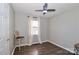 Neutral bedroom with a ceiling fan, natural light, and a decorative chair at 161 Westscott Dr, Statesville, NC 28625