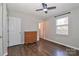 Bedroom with hardwood floors, dresser, and access to bathroom at 161 Westscott Dr, Statesville, NC 28625