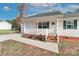 This charming house features a welcoming front porch with white railings and a brick walkway at 161 Westscott Dr, Statesville, NC 28625