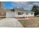 Nice curb appeal! White house with green shutters, attached garage, and a neat front yard at 161 Westscott Dr, Statesville, NC 28625