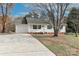 Inviting single-story home featuring green shutters, a welcoming front porch, and an attached garage at 161 Westscott Dr, Statesville, NC 28625