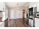 Open kitchen with stainless steel fridge, butcher block counters, white cabinetry and easy access to the deck at 161 Westscott Dr, Statesville, NC 28625