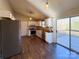 Charming kitchen with white cabinets, butcher block countertops, and stainless steel appliances. Door to the deck visible at 161 Westscott Dr, Statesville, NC 28625