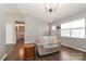 Living room with hardwood floors, neutral walls, and a comfortable loveseat at 161 Westscott Dr, Statesville, NC 28625