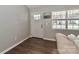 Bright living room featuring hardwood floors and a view of the front yard at 161 Westscott Dr, Statesville, NC 28625