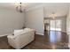 Open-concept living room with hardwood floors and seamless transition to the adjacent kitchen area at 161 Westscott Dr, Statesville, NC 28625