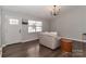 Cozy living room with hardwood floors, neutral paint, and bright natural light at 161 Westscott Dr, Statesville, NC 28625