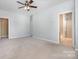 Spacious bedroom with carpet flooring and access to a private bathroom at 18107 Amberwood Glen Dr, Cornelius, NC 28031